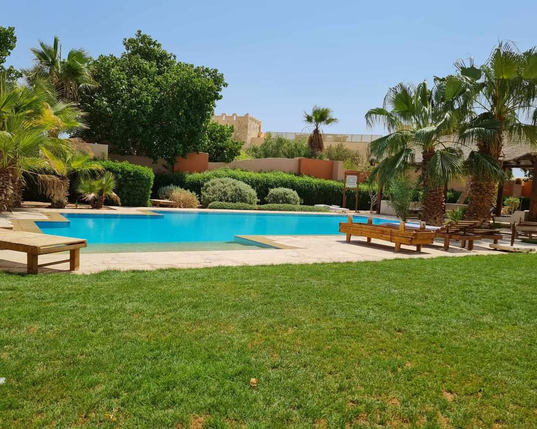 Renzo -   One bedroom apartment with a big terrace and pool view in Gouna